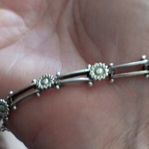 Elegant Silver Bracelet with Floral Accents